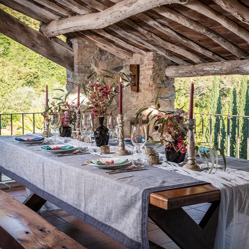 Beautifully dressed table in bright open loggia at Al Bastini